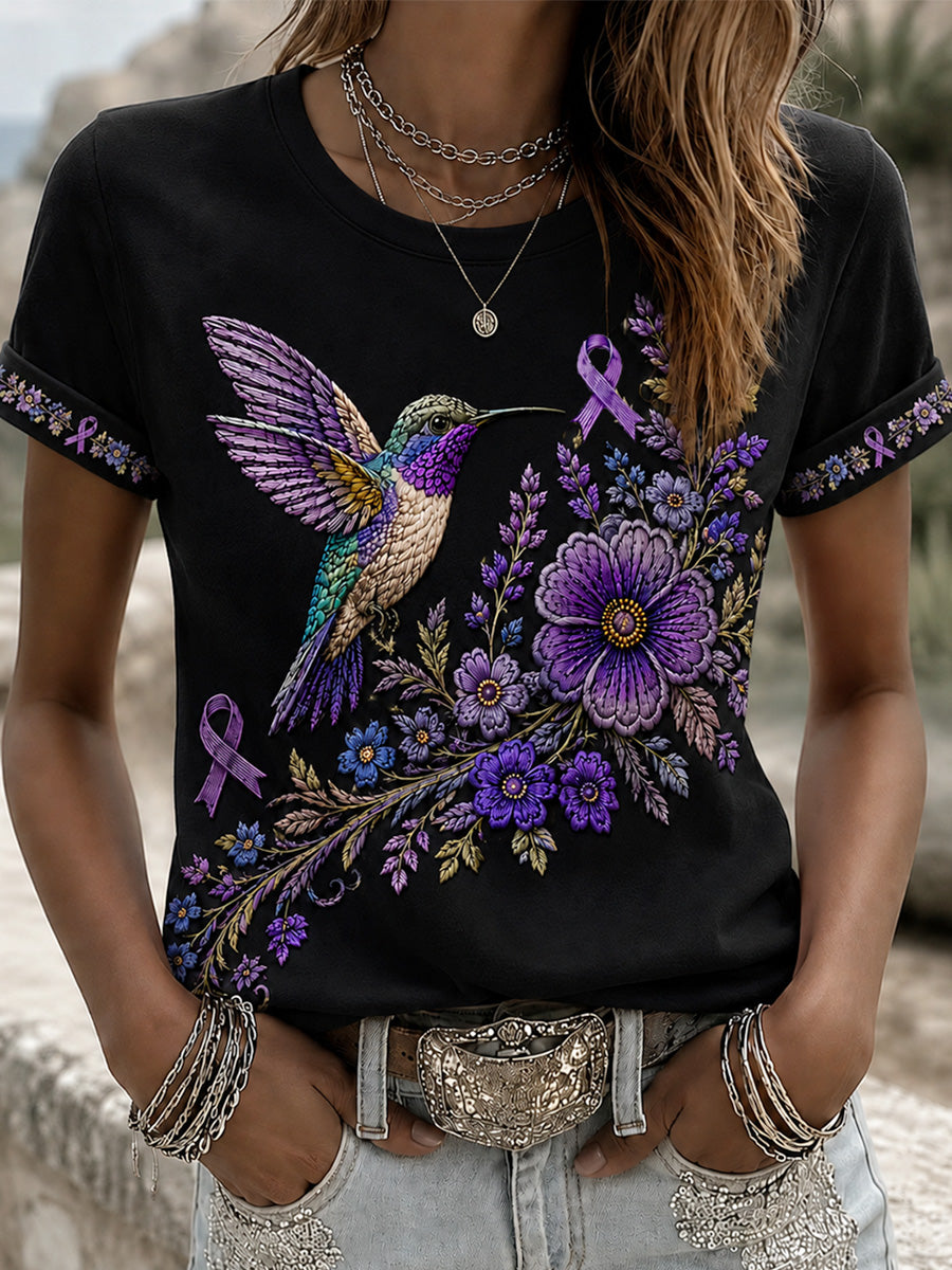 Damen-T-Shirt in Lila mit Blumen- und Kolibri-Print zur Sensibilisierung für Alzheimer