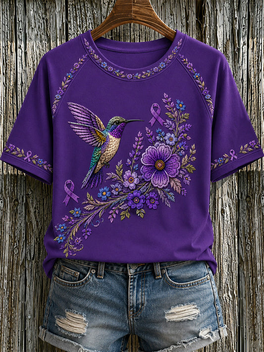 Damen-T-Shirt in Lila mit Blumen- und Kolibri-Print zur Sensibilisierung für Alzheimer