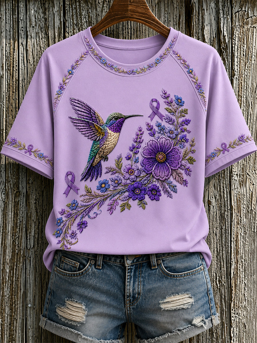 Damen-T-Shirt in Lila mit Blumen- und Kolibri-Print zur Sensibilisierung für Alzheimer