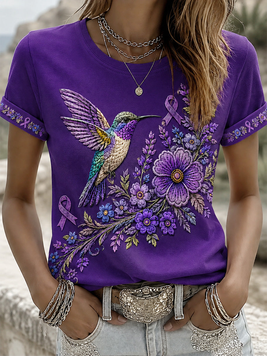 Damen-T-Shirt in Lila mit Blumen- und Kolibri-Print zur Sensibilisierung für Alzheimer