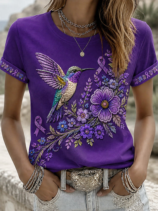 Damen-T-Shirt in Lila mit Blumen- und Kolibri-Print zur Sensibilisierung für Alzheimer