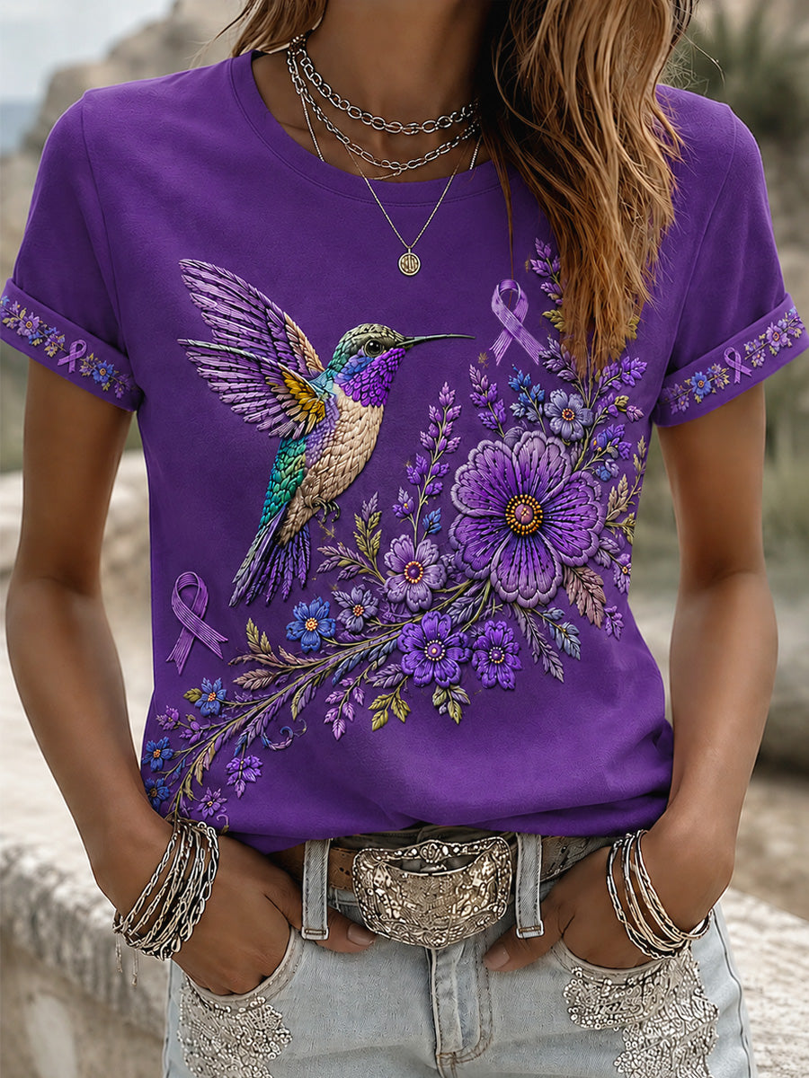 Damen-T-Shirt in Lila mit Blumen- und Kolibri-Print zur Sensibilisierung für Alzheimer