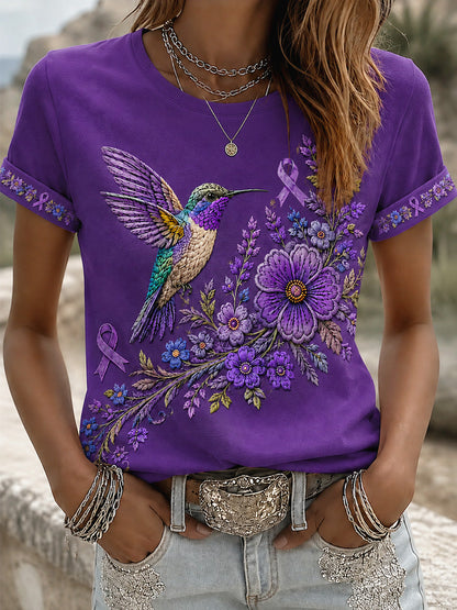 Damen-T-Shirt in Lila mit Blumen- und Kolibri-Print zur Sensibilisierung für Alzheimer