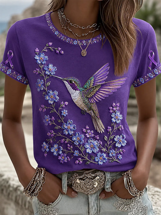 Damen-T-Shirt in Lila mit Blumen- und Kolibri-Print zur Sensibilisierung für Alzheimer