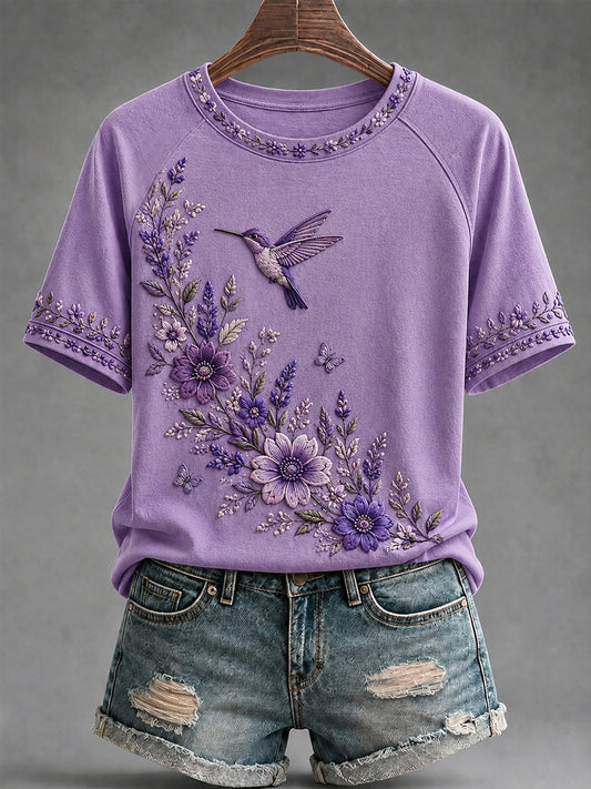 Damen-T-Shirt in Lila mit Blumen- und Kolibri-Print zur Sensibilisierung für Alzheimer